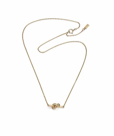 Produktbilde av Efva Attling Love knot & stars necklace laget av gult gull og diamanter.